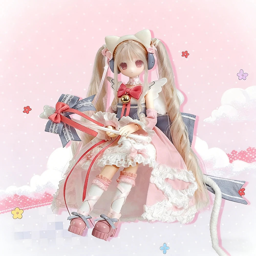 A female doll with long blonde hair and pink clothing wearing a bow and wings, displayed in a blind box packaging.