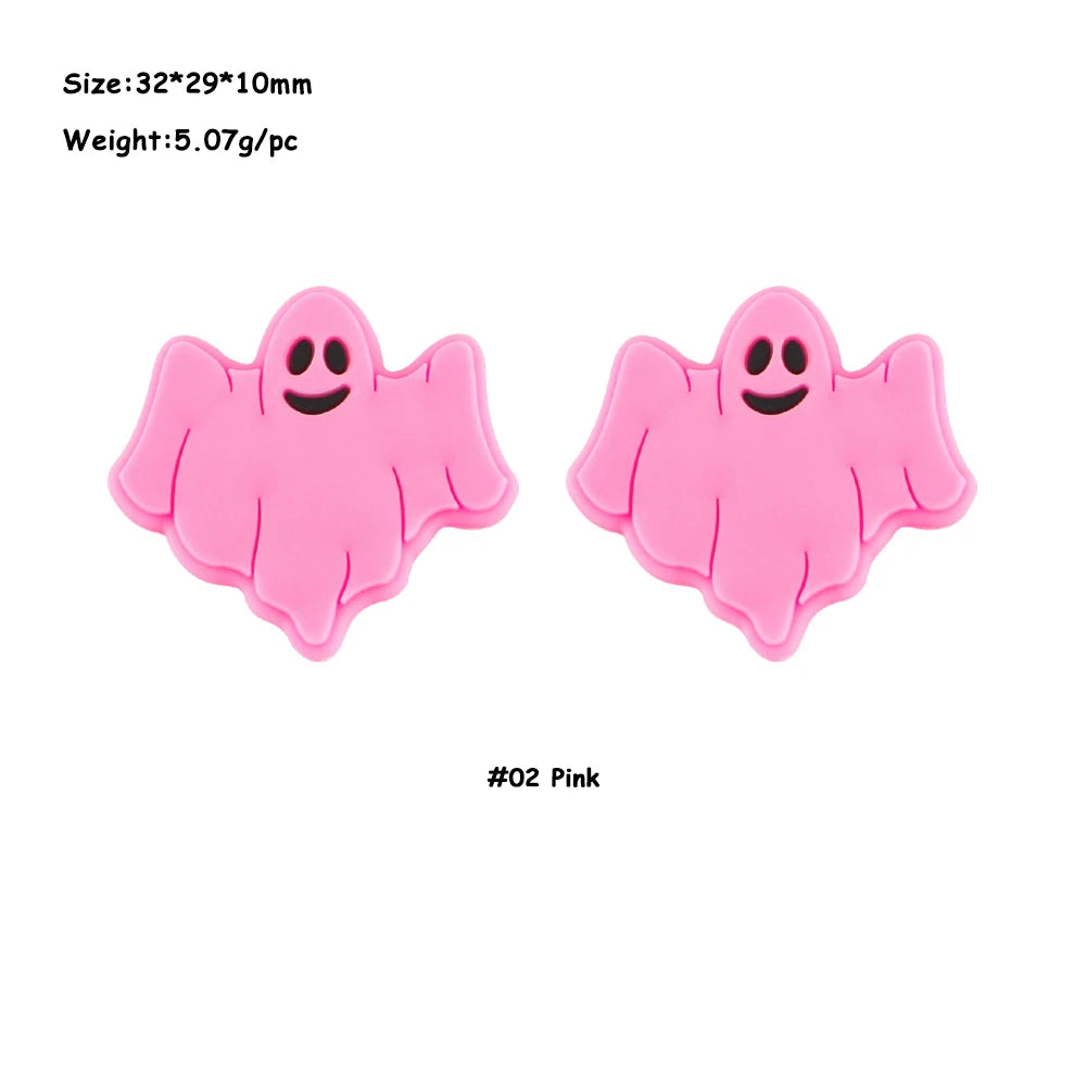 A pair of pink ghost-shaped silicone beads for jewelry making