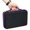 A hand is holding a black diamond painting storage and accessory organizer kit with purple trim.