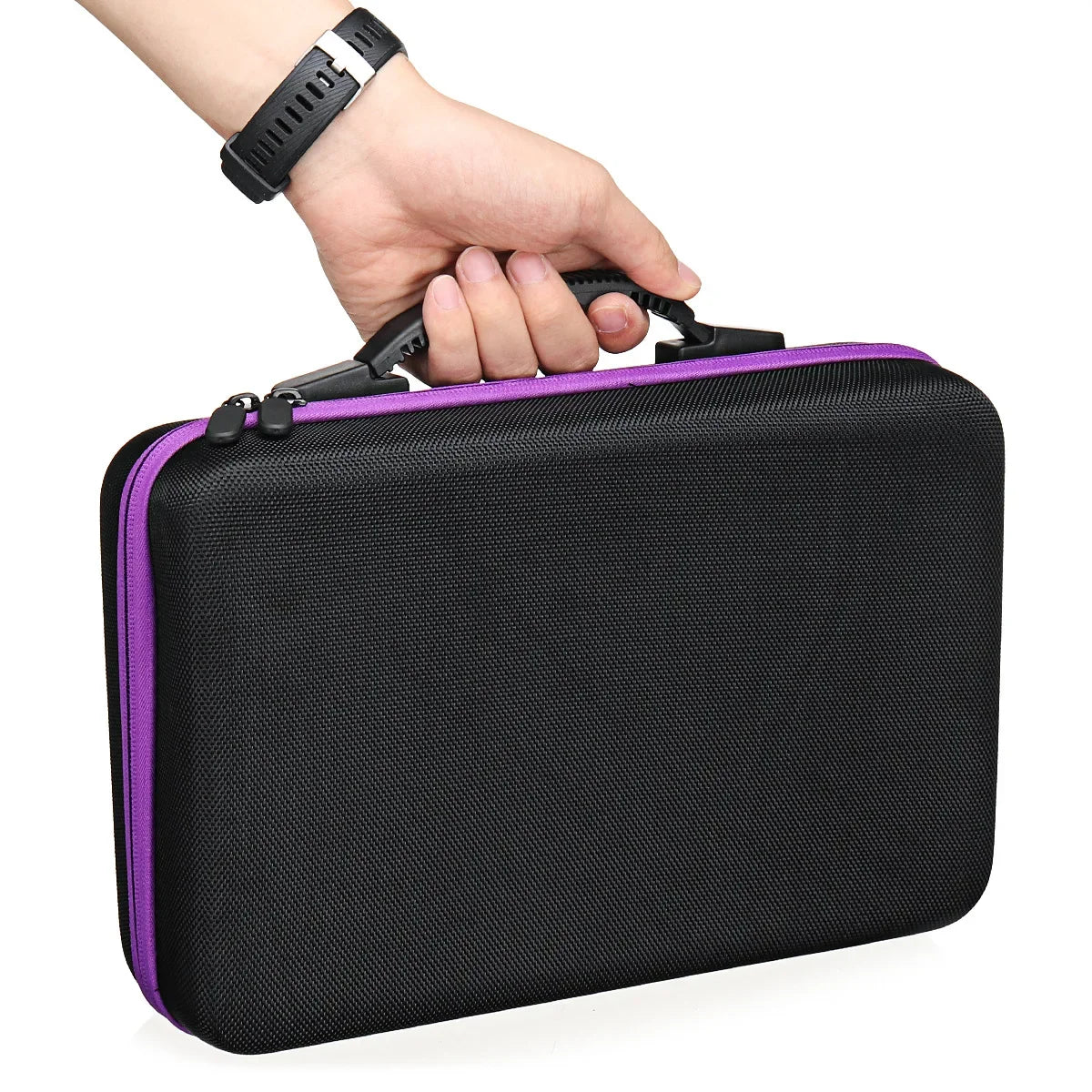 A hand is holding a black diamond painting storage and accessory organizer kit with purple trim.