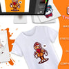 A white t-shirt featuring a red and yellow graphic, displayed next to DTF transfer film sheets and a computer screen.