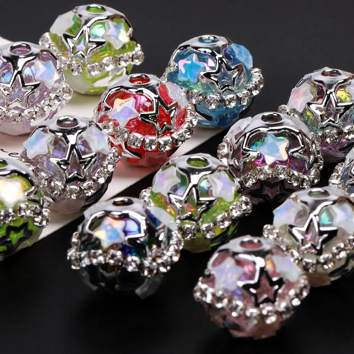 A collection of iridescent silver star rhinestone acrylic beads for jewelry making