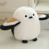 A white cartoon bird plush with black accents is shown against a light background.