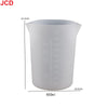 White flexible silicone measuring cup with volume markings and a 12.3cm height.