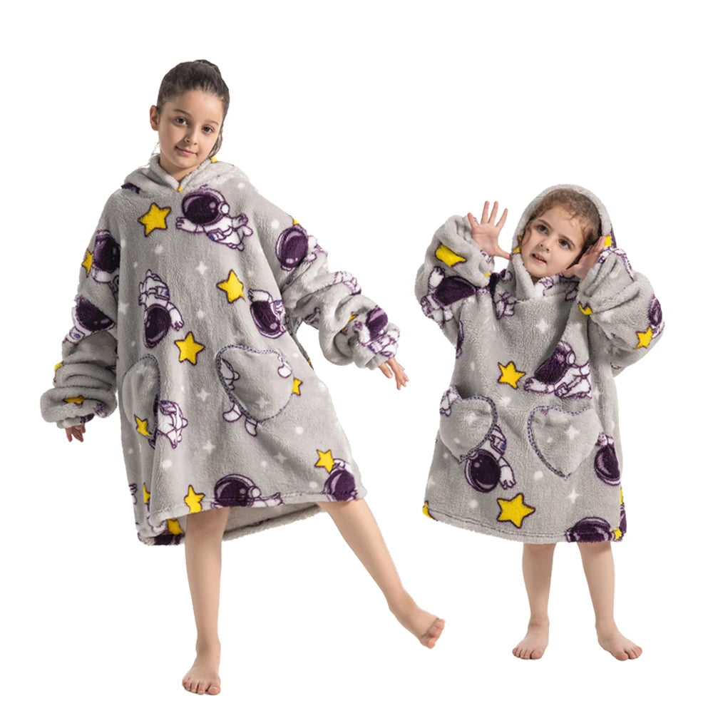 A young girl models a gray and purple cozy kids' flannel hoodie sweater for winter.