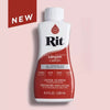 A bottle of Rit canyon all-purpose dye with a white cap and red label against a pink background.