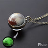 A pendant necklace featuring a spherical charm depicting the surface of Pluto with reddish and white tones.