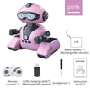 A pink interactive robot toy with large eyes, holding a remote control and accessories.