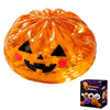 An orange Halloween squishy stress ball toy with a carved jack-o'-lantern face.