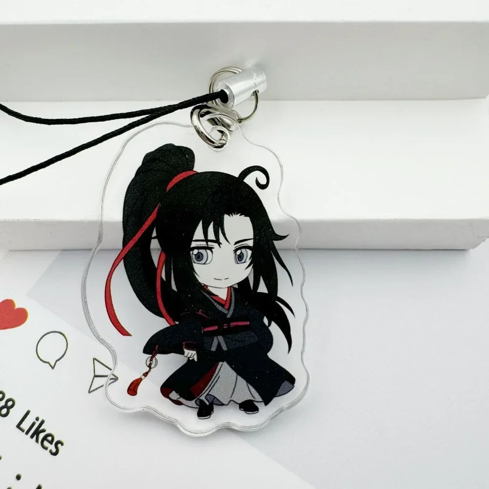 A clear acrylic pendant featuring an anime-style character with black hair tied in a high ponytail and wearing dark clothing,