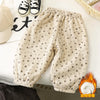 Light beige corduroy toddler overalls featuring a small, repeating heart embroidery pattern.
