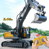 A remote control excavator toy with a yellow body and black arm is shown in an outdoor setting.
