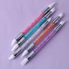 A collection of dual-ended silicone nail art dotting pens with crystal handles in various shades of pink, blue, and purple.