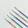A set of ten colorful stainless steel clay sculpting tools with various shapes and finishes.