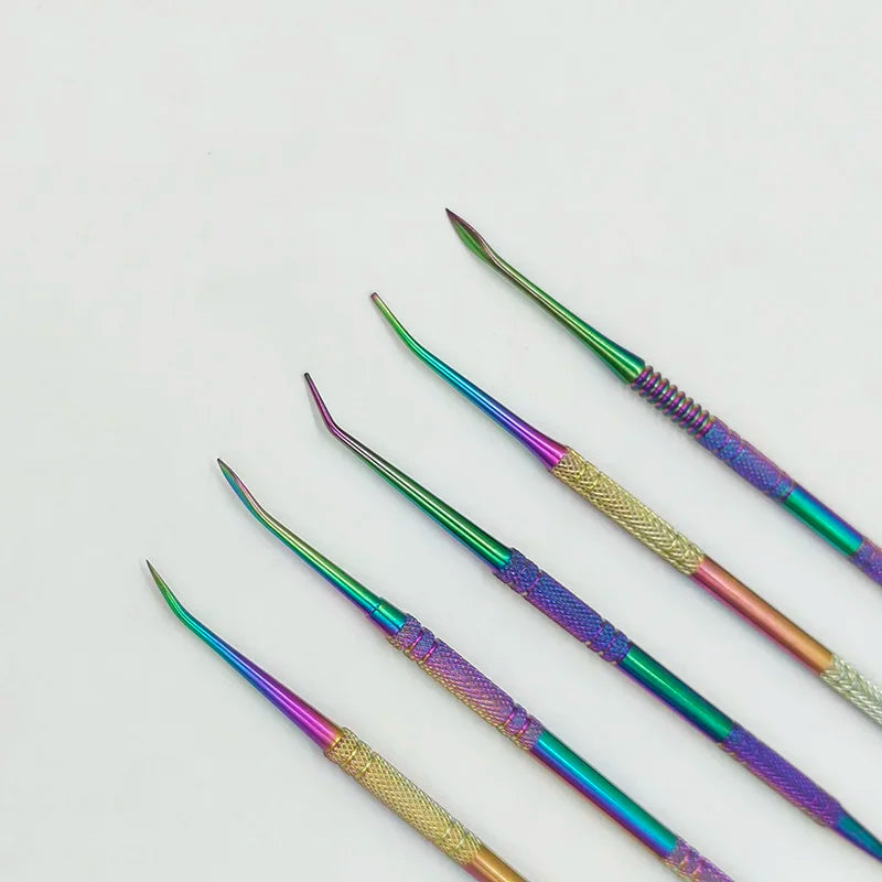 A set of ten colorful stainless steel clay sculpting tools with various shapes and finishes.