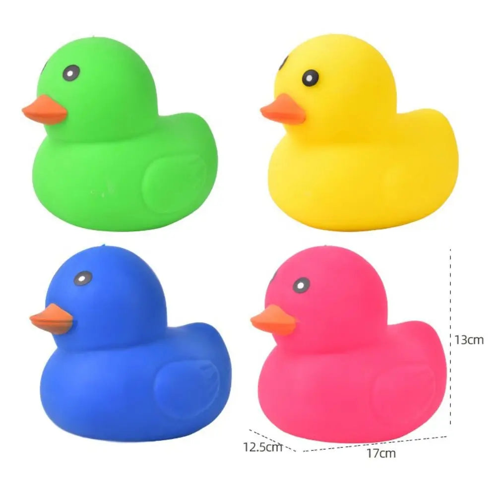 Three plastic duck toys in green, yellow, and pink are shown side by side.