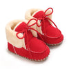 Pair of red and cream faux fur baby winter boots for first walkers