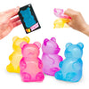 A hand holds a pack of gummy bear squeeze toys and several colorful plastic bear fidget toys.
