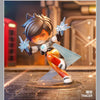 A Tracer collectible figurine in action, featuring translucent blue energy effects and detailed armor.