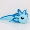 A light blue plush toy of an axolotl with spiky fins and large eyes.