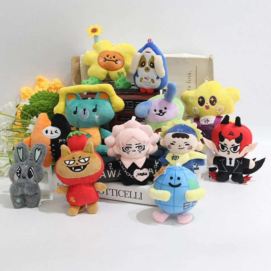 A collection of plush pendant dolls featuring characters from GMMTV celebrity couples in various colors and poses.