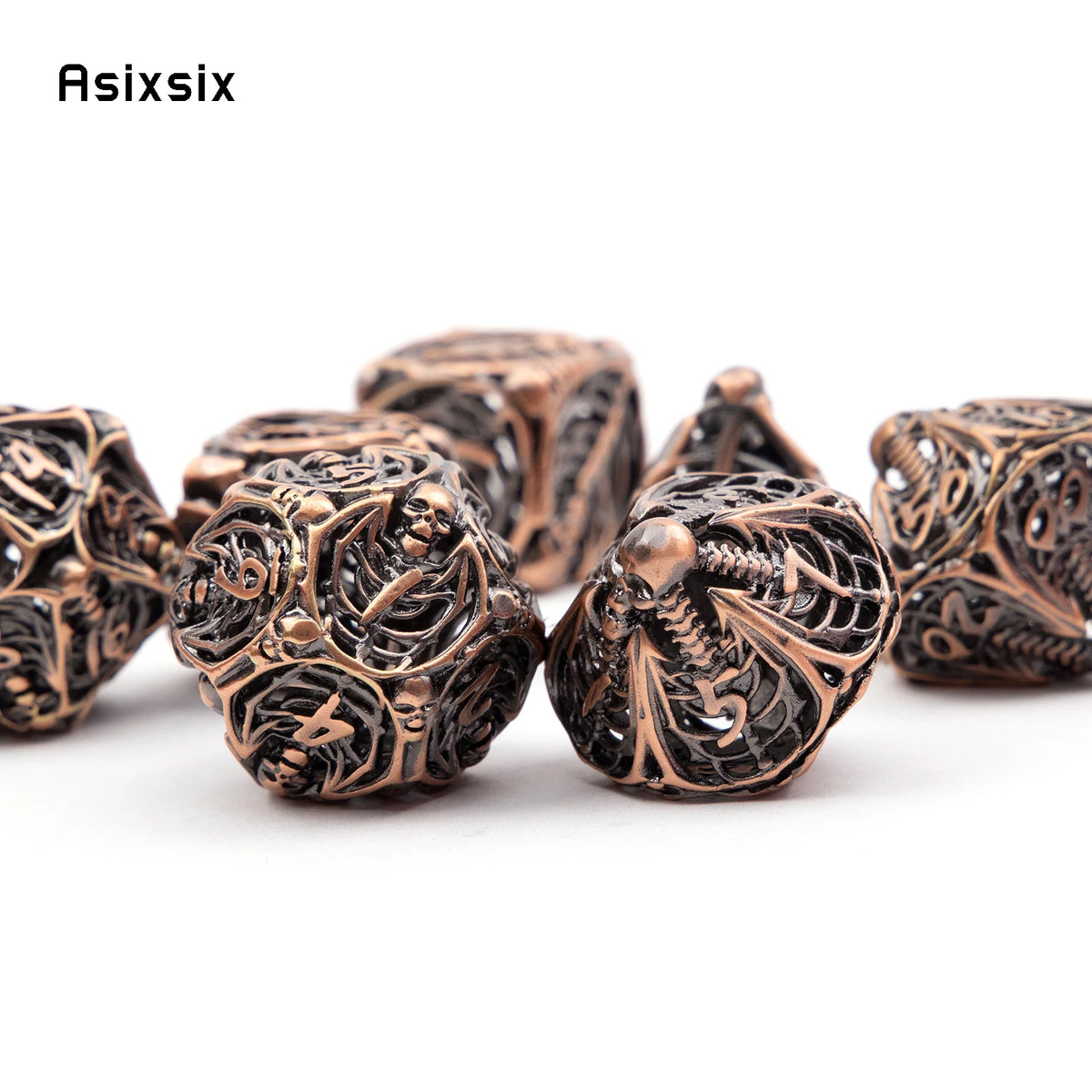 A set of coppery skull metal polyhedral dice used for tabletop role-playing games