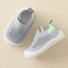 A pair of light gray breathable mesh slip-on sneakers for toddlers, shown from above.