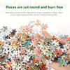 A hand holds a pile of black clover anime jigsaw puzzle pieces.