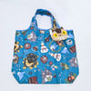 A blue fabric tote bag featuring a pattern of cute animal faces and designs.
