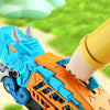A blue and orange dinosaur transport truck toy set with transforming die-cast cars is shown in a close-up view against a gree