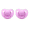 A pair of pink silicone pacifier covers with protective ears for baby soothers