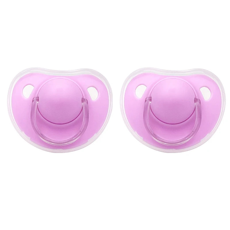 A pair of pink silicone pacifier covers with protective ears for baby soothers