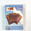 A box of 54 playing cards featuring a purple and gold design for parties and game nights.