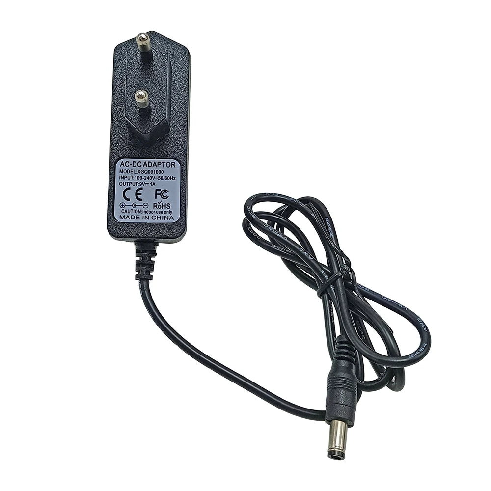 Black AC adapter for a guitar pedal power supply with input 100-240V and output 9V 1A