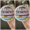 A close-up of a Mini Geladeira toy with colorful labels and packaging details.