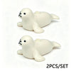A set of two white marine animal building blocks, including a shark and an octopus.