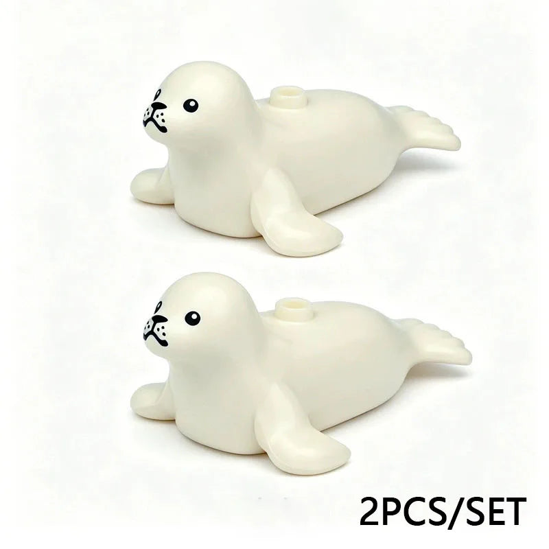 A set of two white marine animal building blocks, including a shark and an octopus.