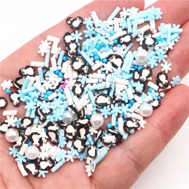 A handful of polymer clay slices in white, black, and light blue colors for DIY crafts