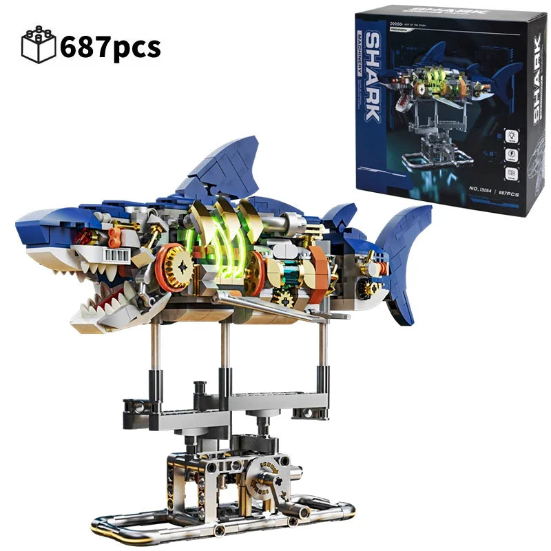 A detailed mechanical shark model built from interlocking plastic pieces, displayed on a stand.