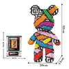 A colorful 3D bear building kit made of micro diamond blocks with a scale reference.