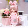 A pink articulated princess doll with long hair wearing a pink dress and a bow accessory.