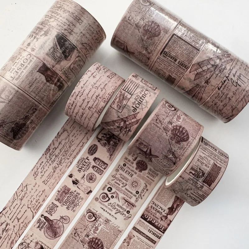 A set of vintage patterned washi tape rolls in muted pink and brown tones for journaling and scrapbooking