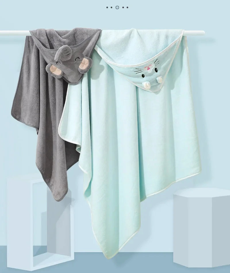 A light mint green hooded animal bath towel hanging on a hanger.