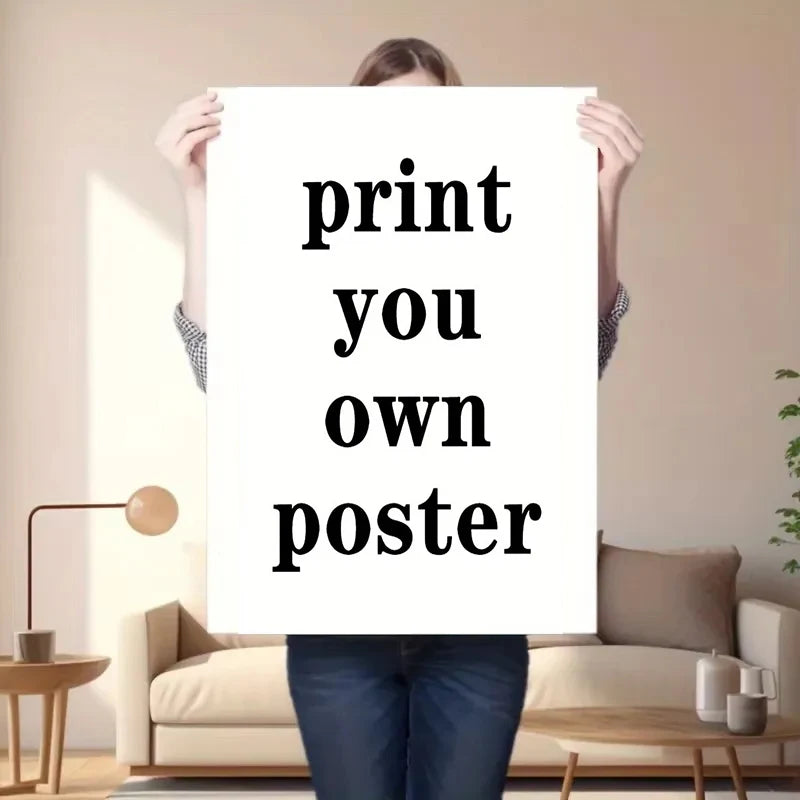 A person holds up a white print with the text print you own poster.