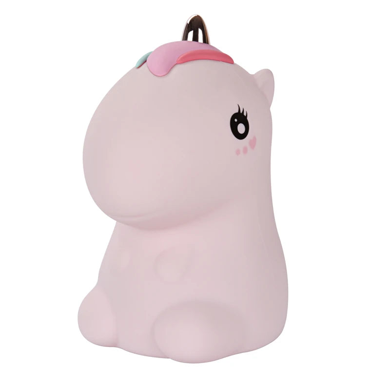 A pink unicorn night light with a horn and eye, featuring LED lighting.