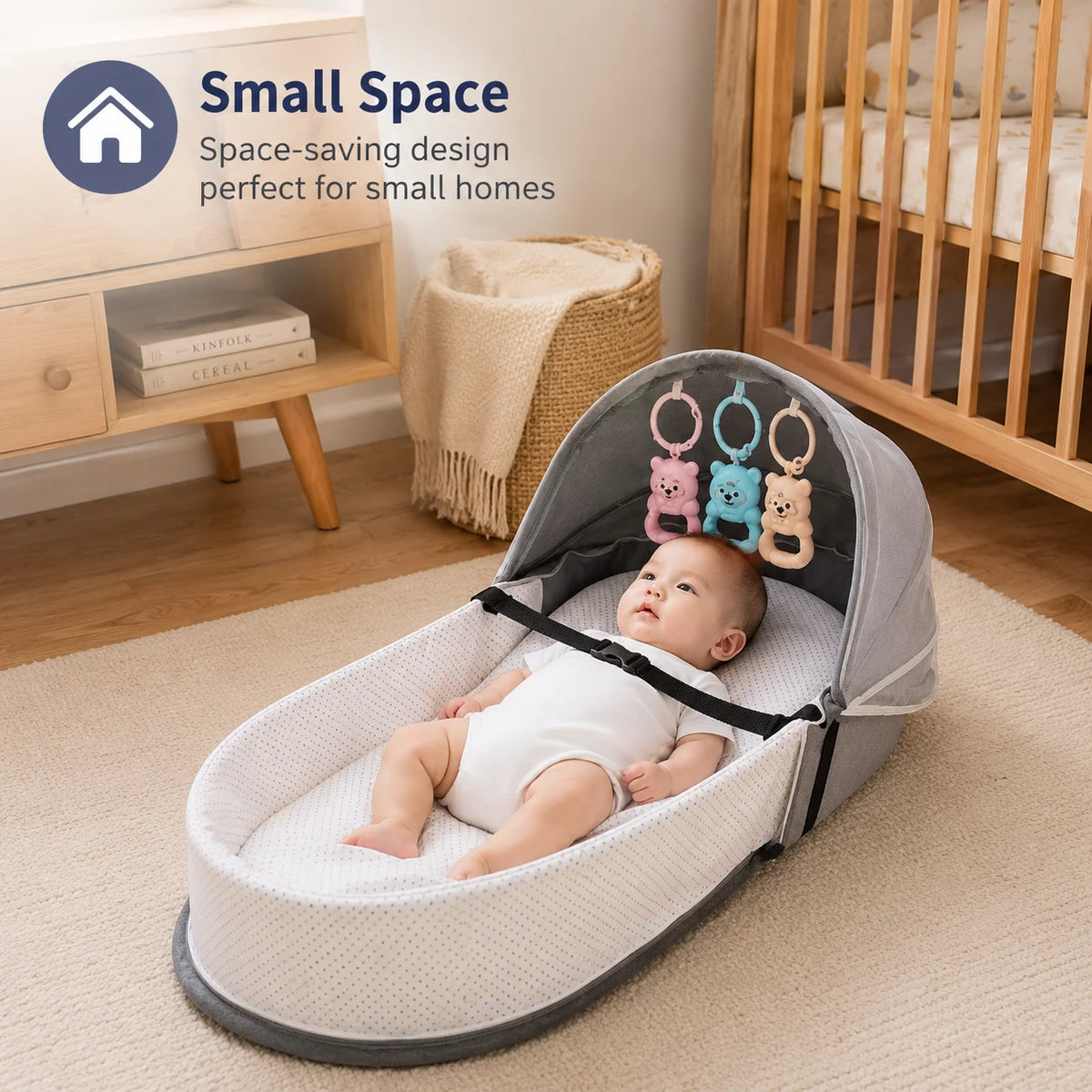 A portable foldable baby bed with a mosquito net and mattress is shown on a light rug.
