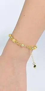 Gold magnetic jewelry clasps for necklaces and bracelets worn on a wrist.