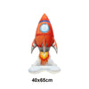 An orange and white foil balloon plane decoration for a birthday party.