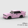 A pink classic rally car building block set with black accents and a dark window.