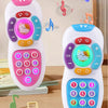 A white music phone toy with colorful buttons, lights, and a cat face, shown next to sheet music.